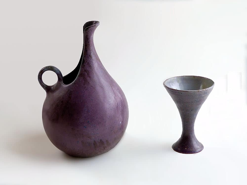 Early Pitxher in Plumb glaze with stoneware wine glass by midcentury industrial designer Weston Neil Amdersem